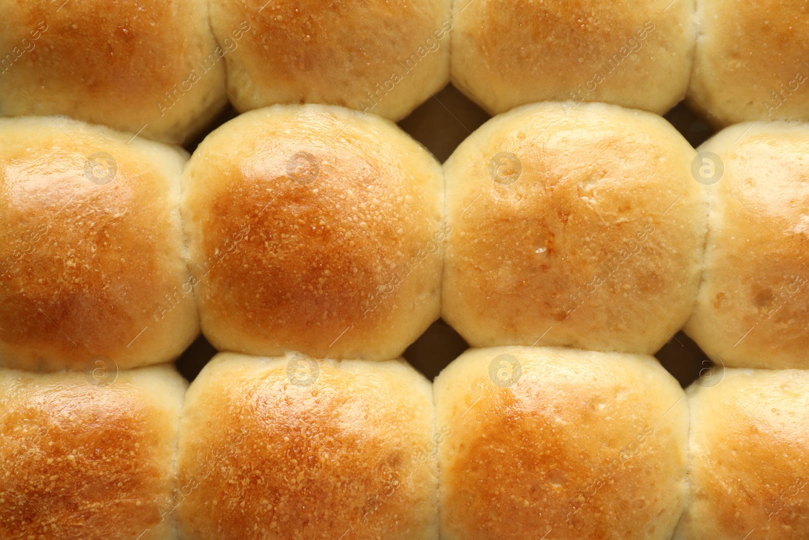 Photo of Many delicious dough balls as background, top view