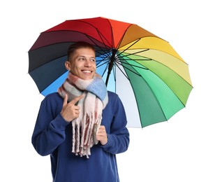 Young man with rainbow umbrella on white background