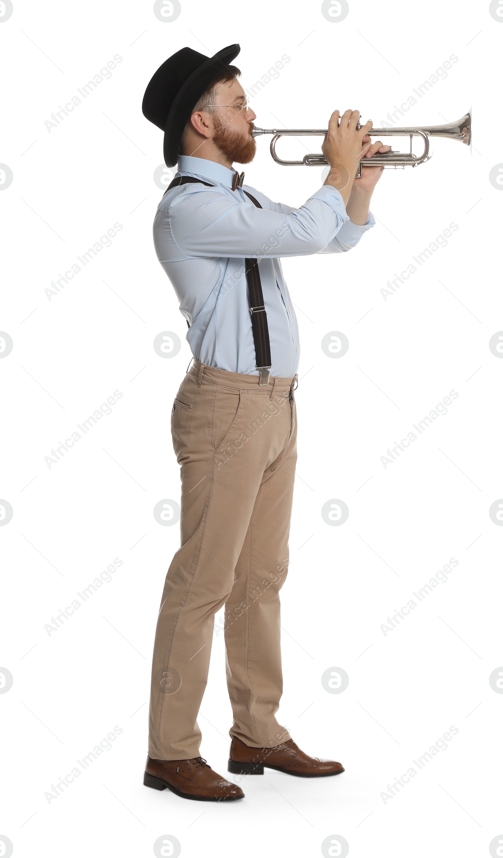 Photo of Handsome musician playing trumpet on white background