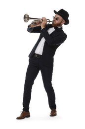 Handsome musician playing trumpet on white background