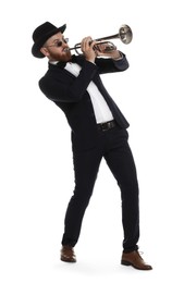 Handsome musician playing trumpet on white background