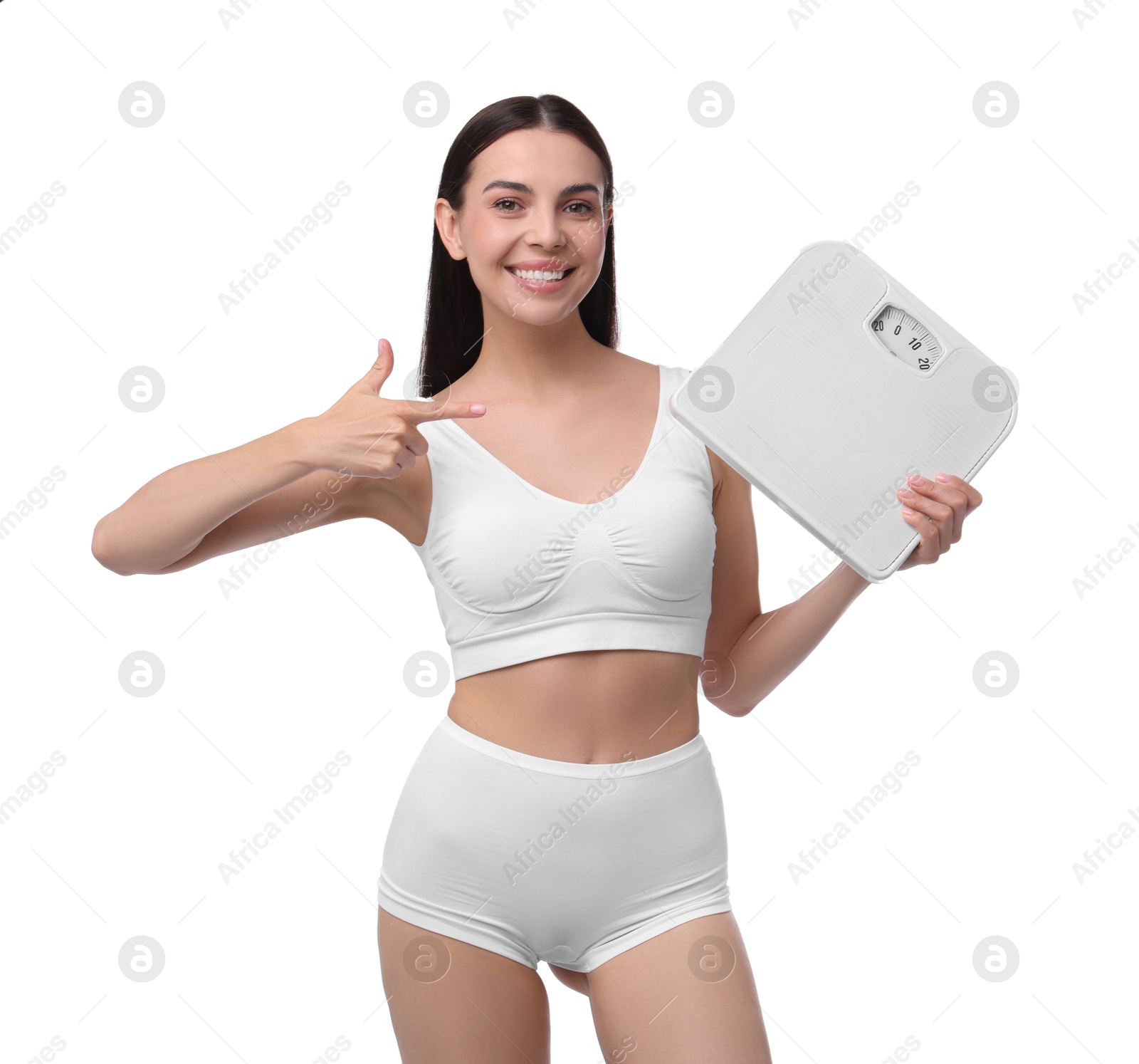 Photo of Diet and weight loss concept. Happy young woman with floor scale on white background