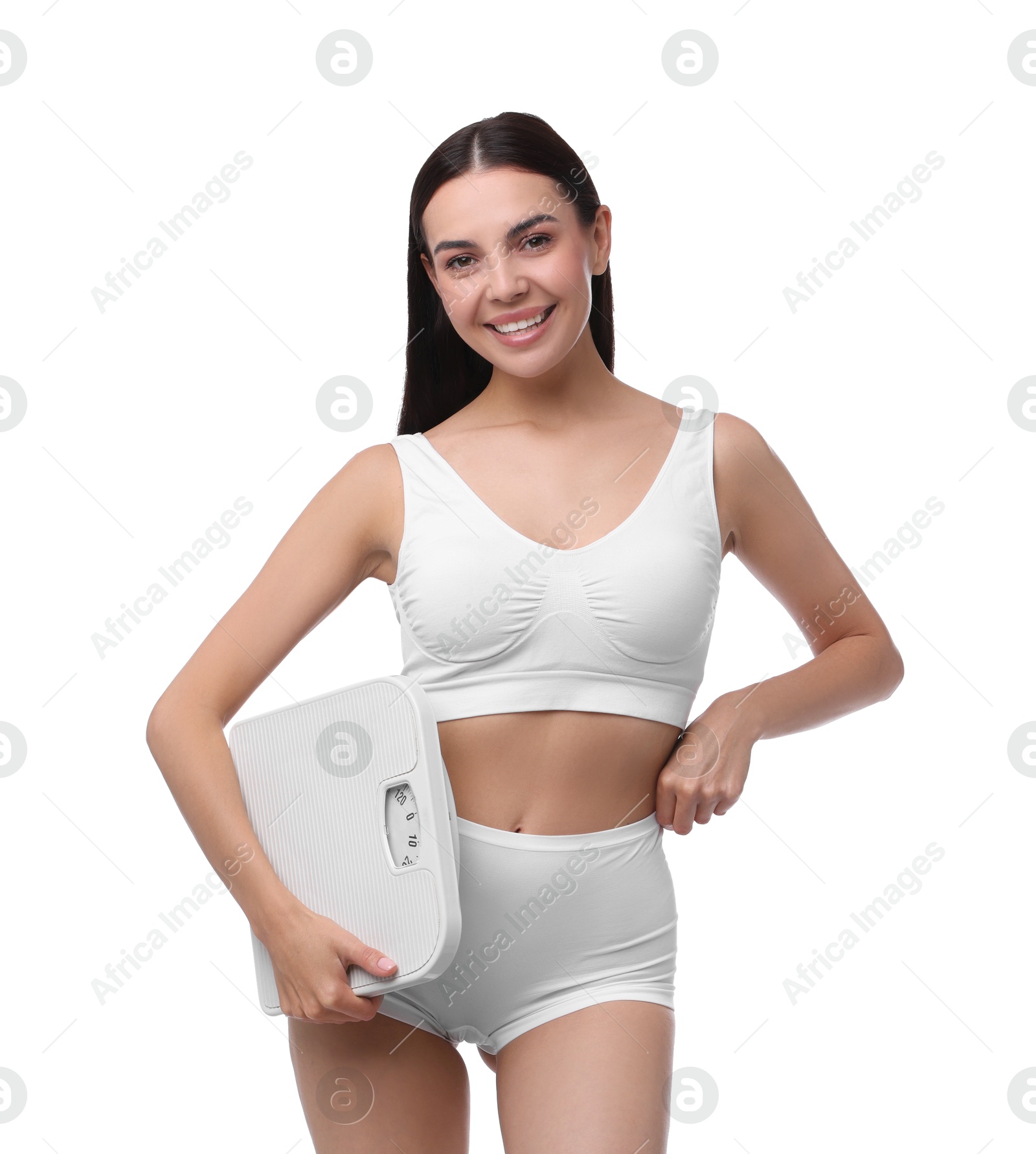 Photo of Diet and weight loss concept. Happy young woman with floor scale on white background