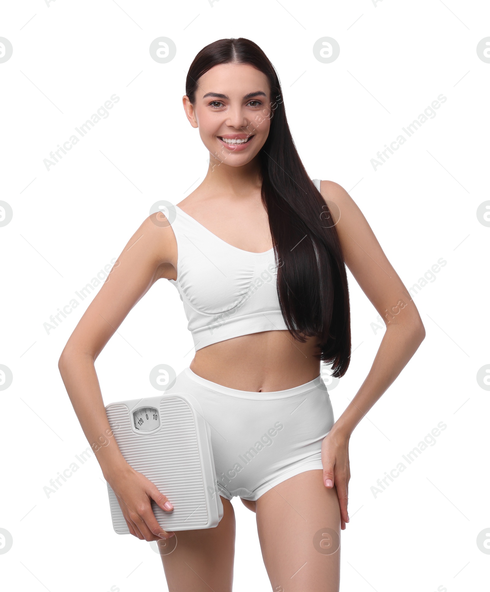 Photo of Diet and weight loss concept. Happy young woman with floor scale on white background