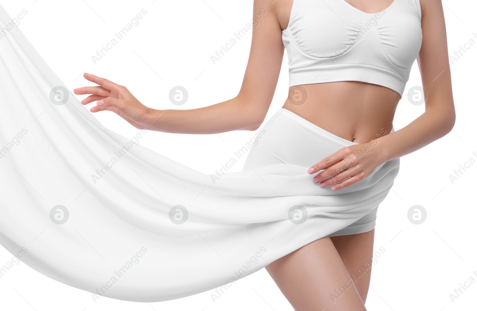 Photo of Diet and weight loss concept. Woman covering her slim body with silk fabric against white background, closeup