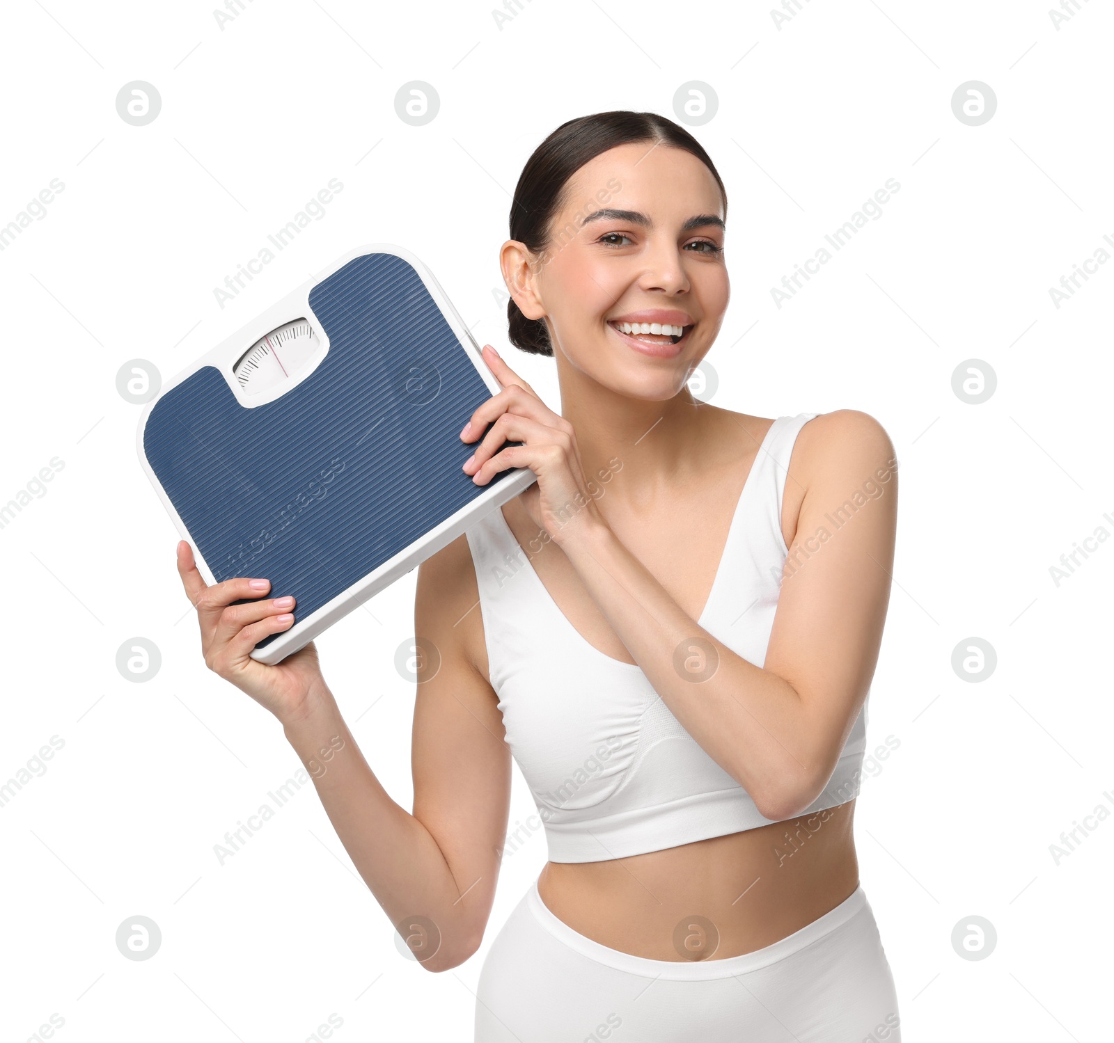 Photo of Diet and weight loss concept. Happy young woman with floor scale on white background