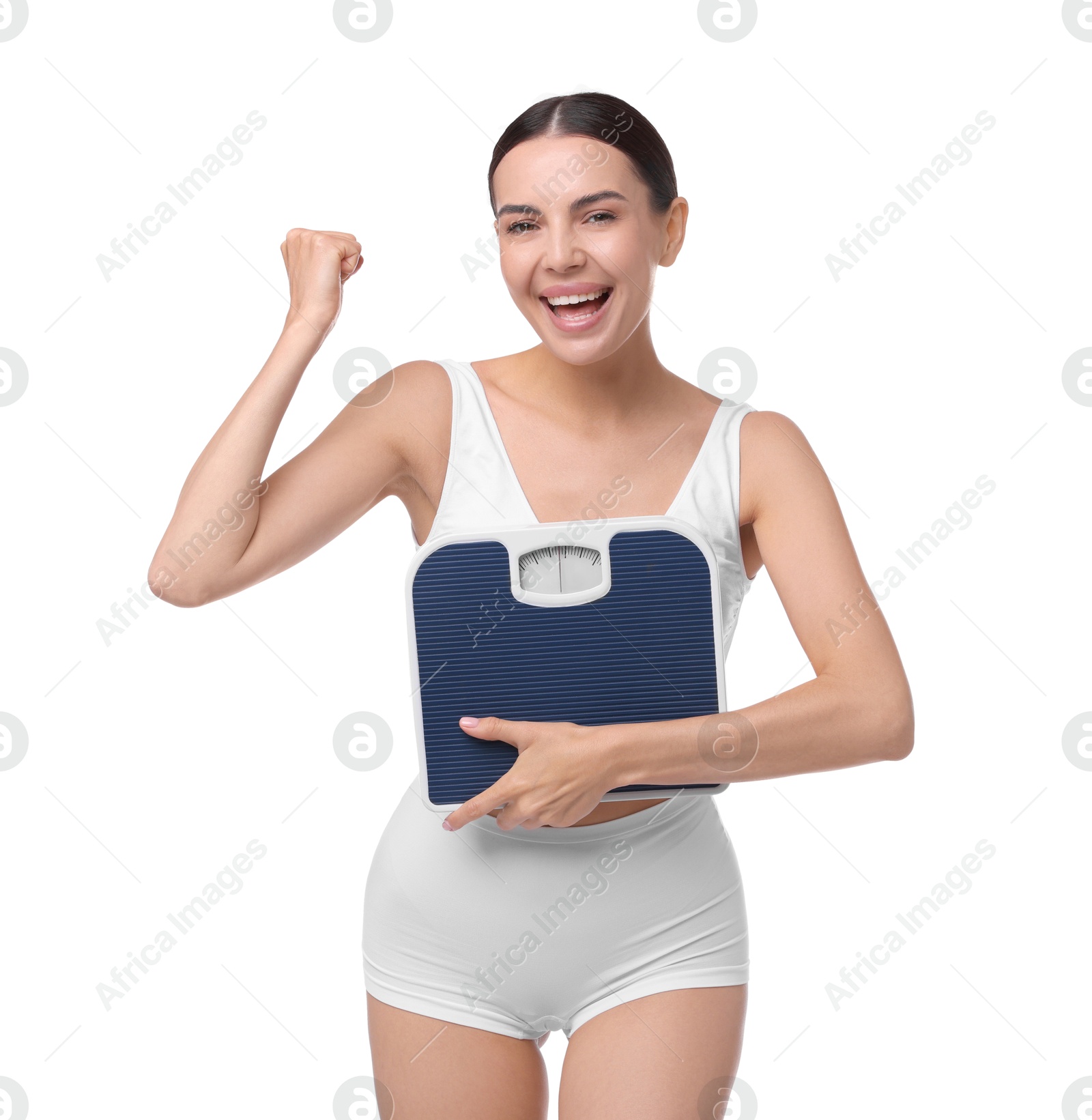 Photo of Diet and weight loss concept. Happy young woman with floor scale on white background