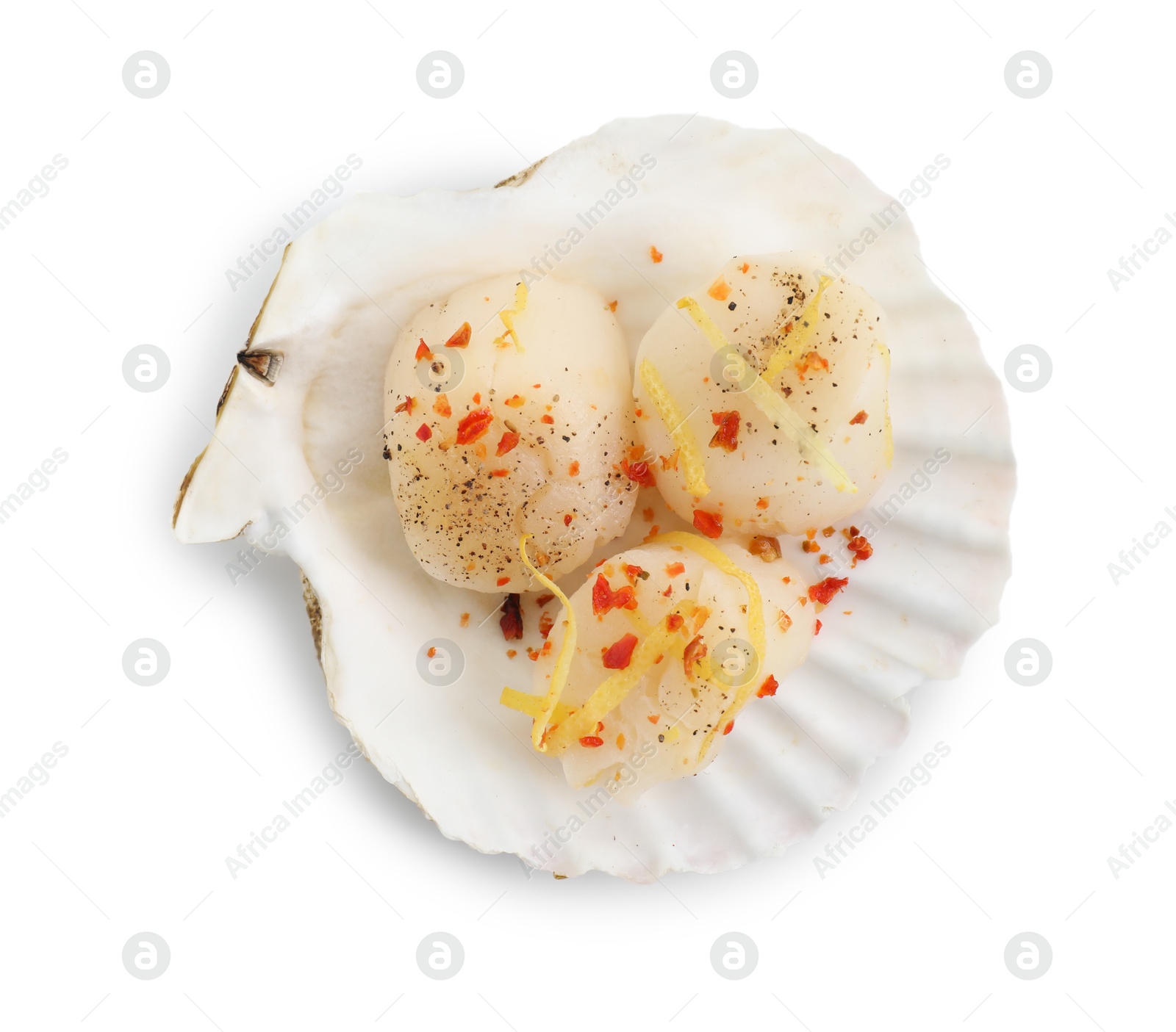 Photo of Raw scallop with lemon zest, spices and shell isolated on white, top view