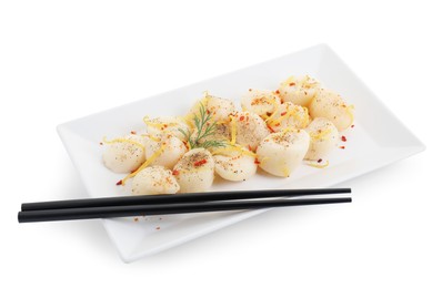 Photo of Raw scallops with spices, dill, lemon zest and chopsticks isolated on white