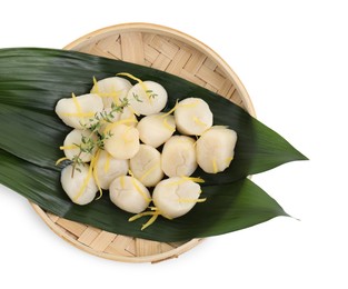 Raw scallops with thyme and lemon zest isolated on white, top view