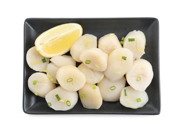 Raw scallops with green onion and lemon isolated on white, top view