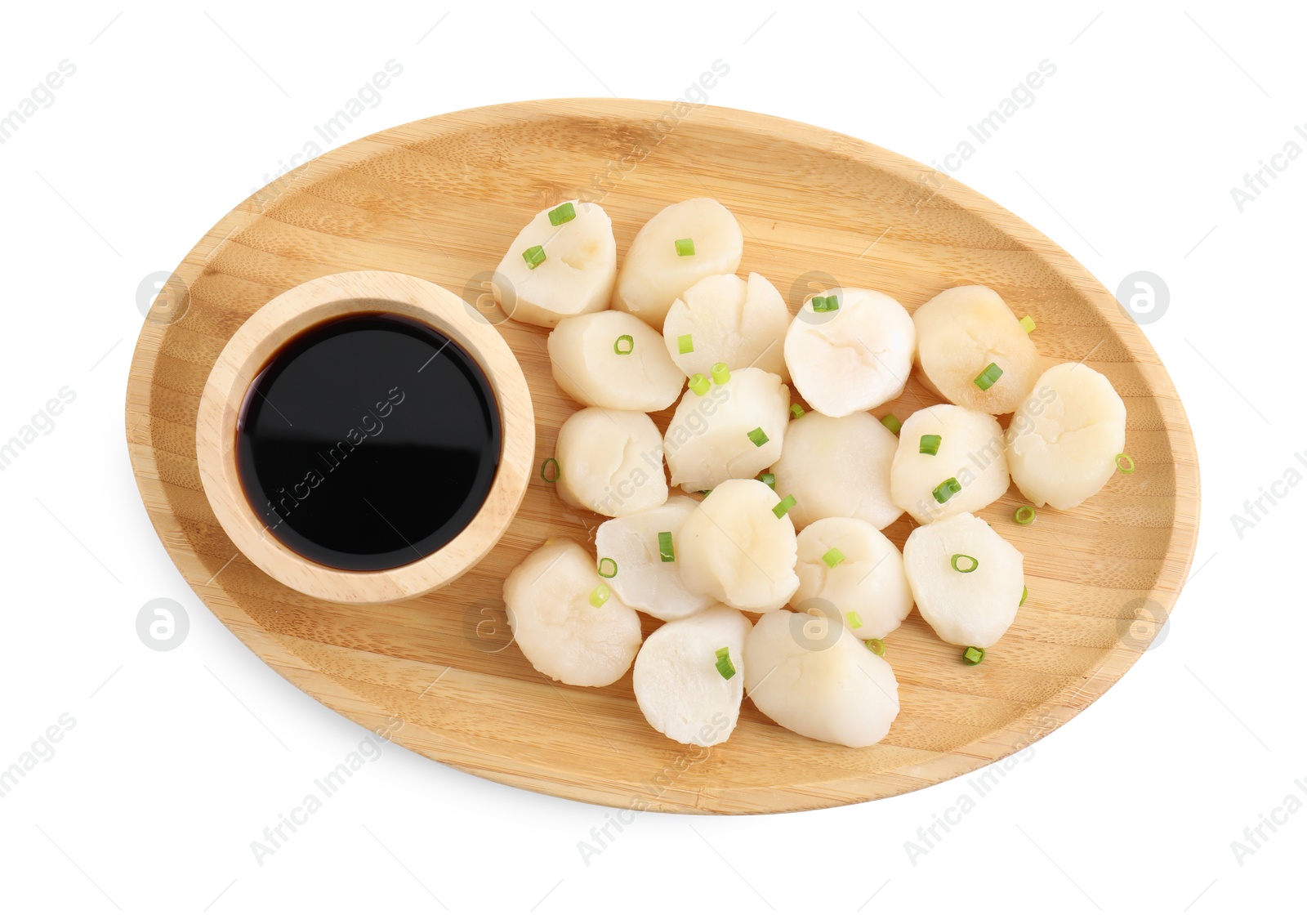 Photo of Raw scallops with green onion and soy sauce isolated on white, top view