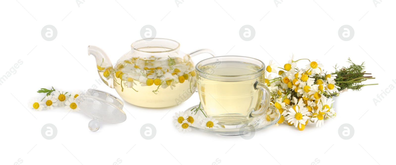 Photo of Aromatic herbal tea with chamomile flowers isolated on white