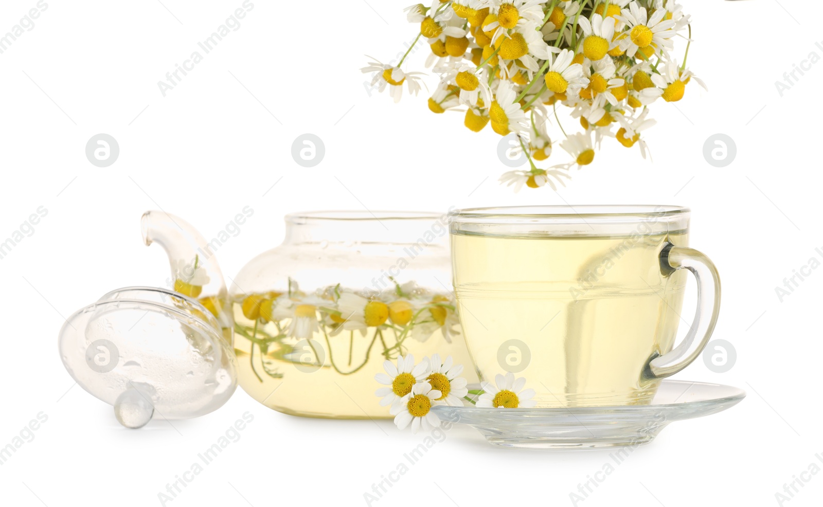 Photo of Aromatic herbal tea with chamomile flowers isolated on white