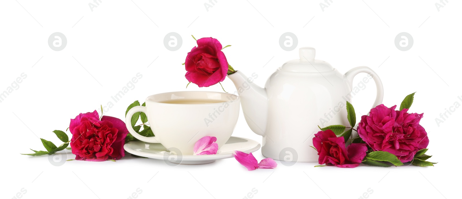 Photo of Aromatic herbal tea with rose flowers isolated on white