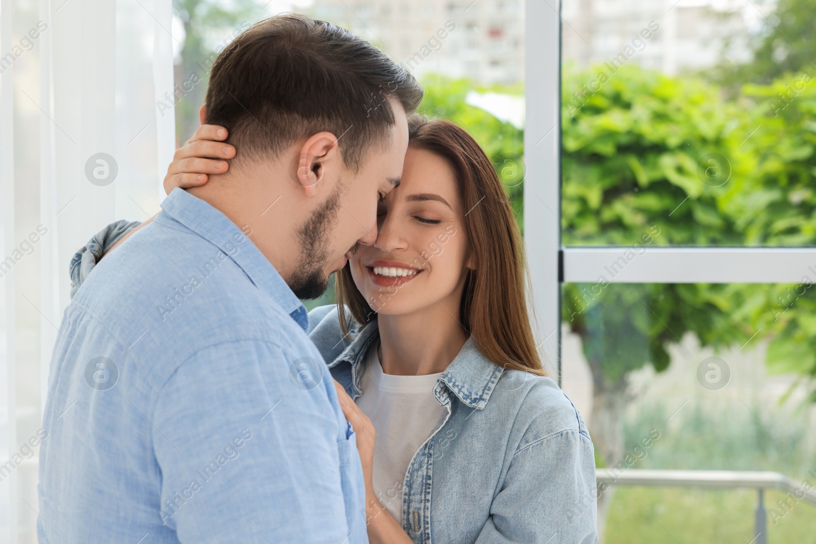 Photo of Happy couple enjoying each other at home