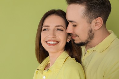 Photo of Happy couple on green background. Strong relationship