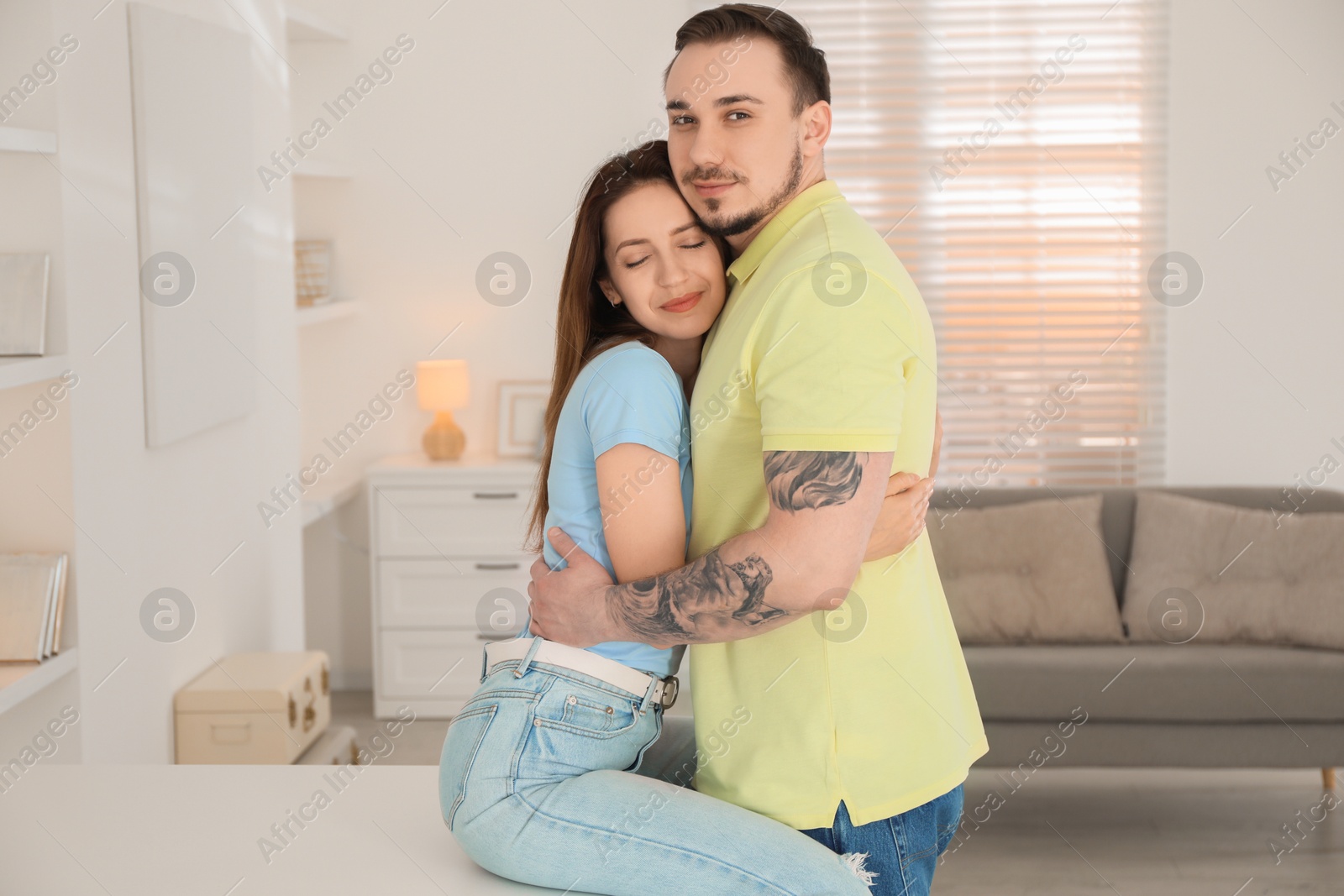 Photo of Cute couple hugging at home. Strong relationship