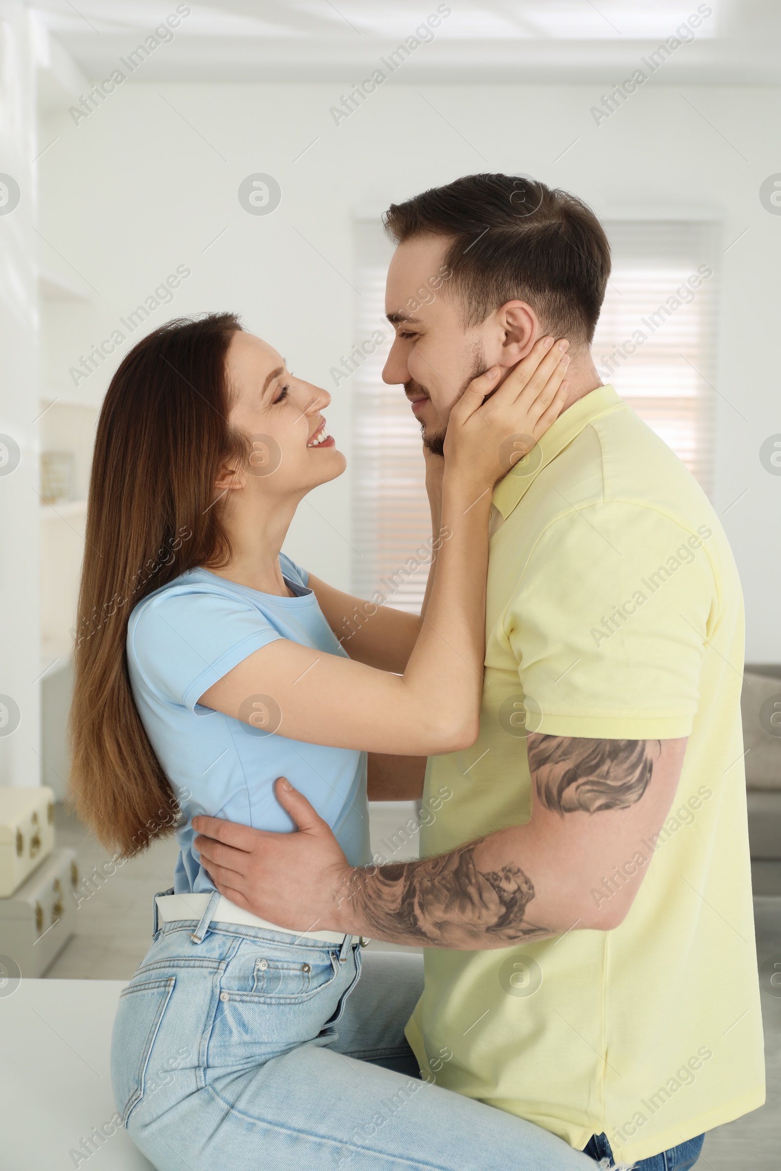 Photo of Happy couple enjoying each other at home