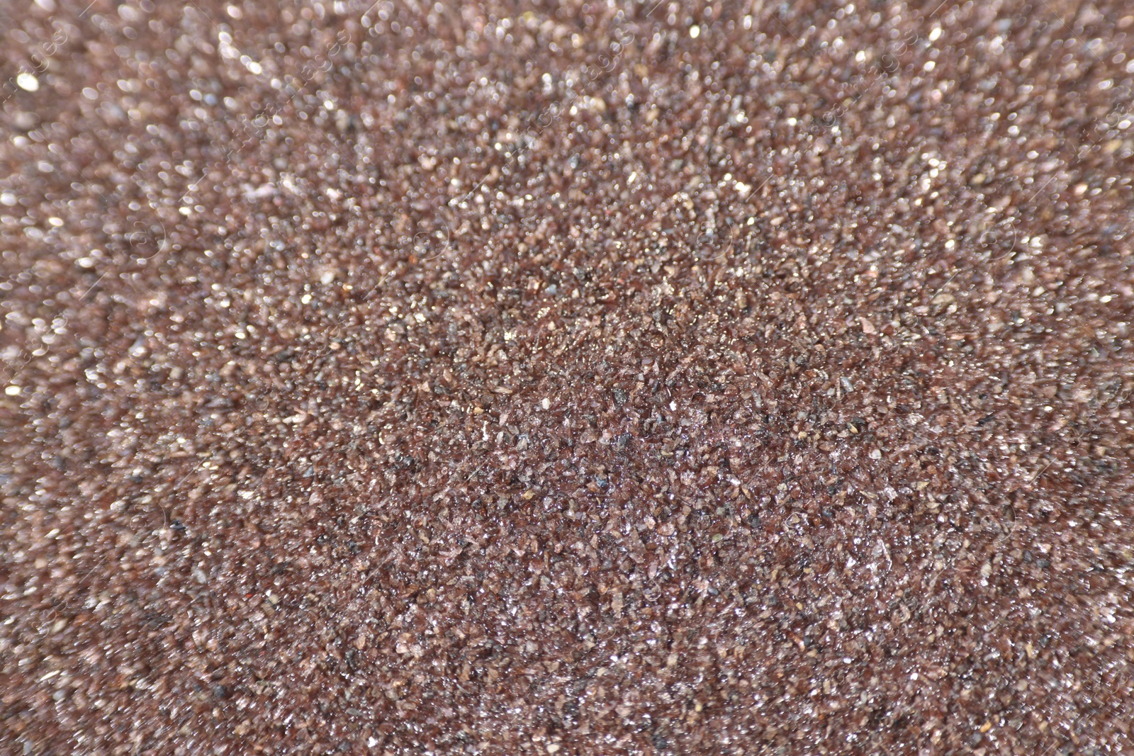 Photo of Texture of coarse sandpaper as background, closeup