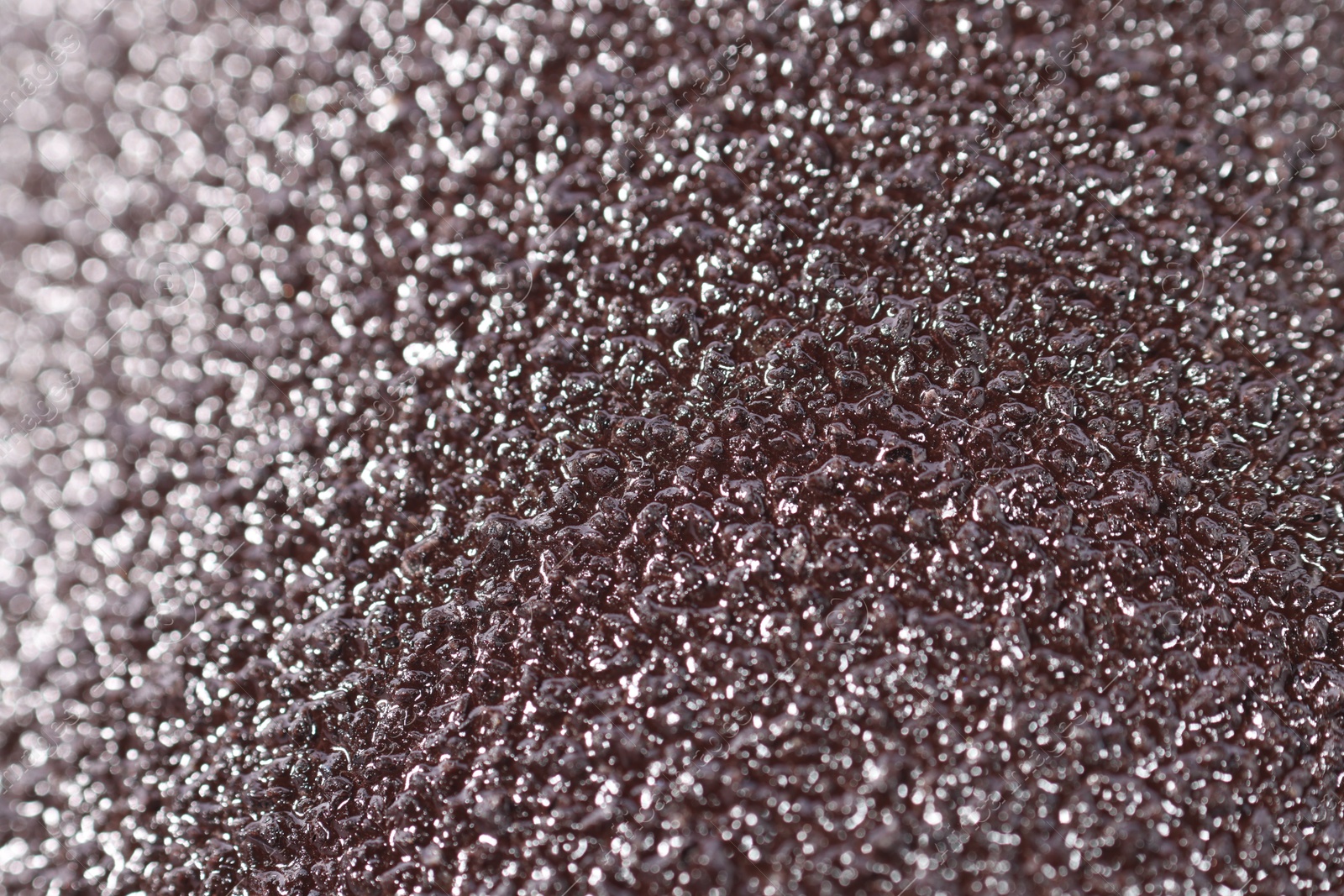 Photo of Texture of coarse sandpaper as background, closeup