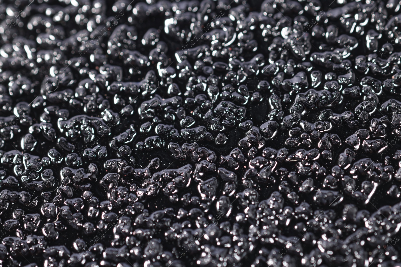 Photo of Texture of coarse sandpaper as background, closeup