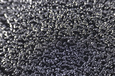 Photo of Texture of coarse sandpaper as background, closeup