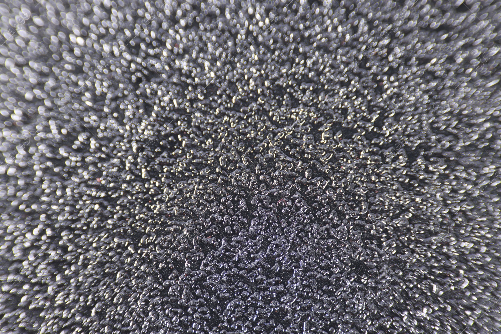 Photo of Texture of coarse sandpaper as background, closeup