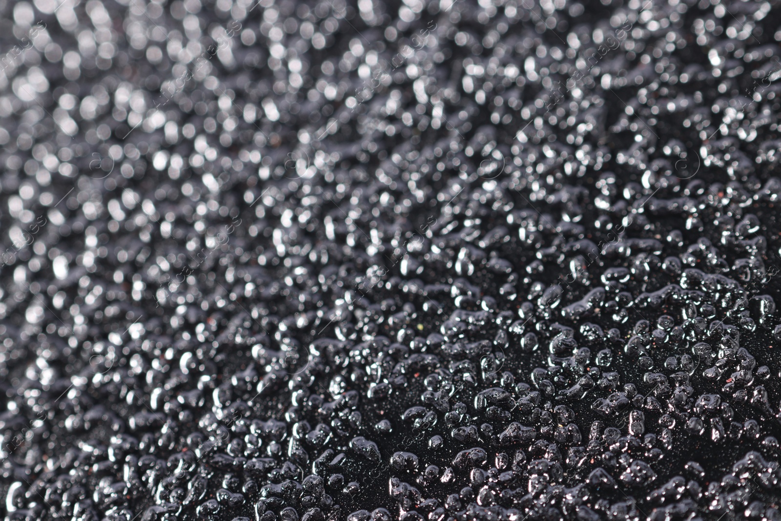 Photo of Texture of coarse sandpaper as background, closeup