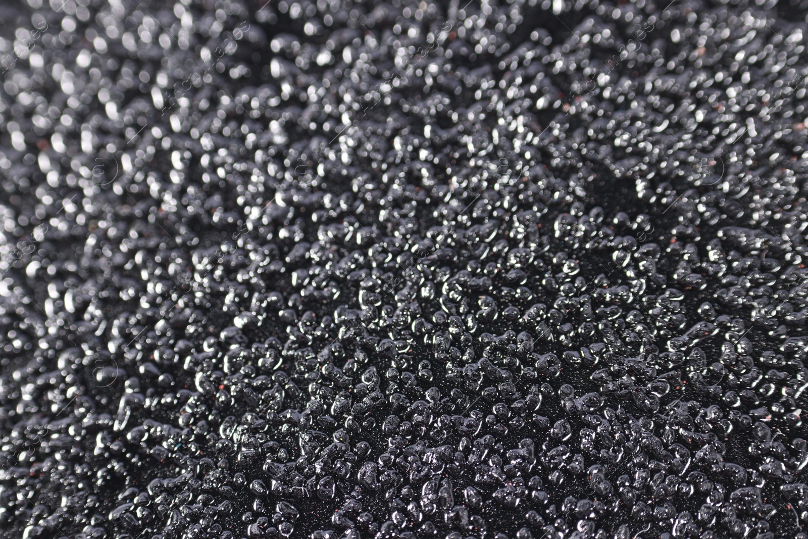 Photo of Texture of coarse sandpaper as background, closeup