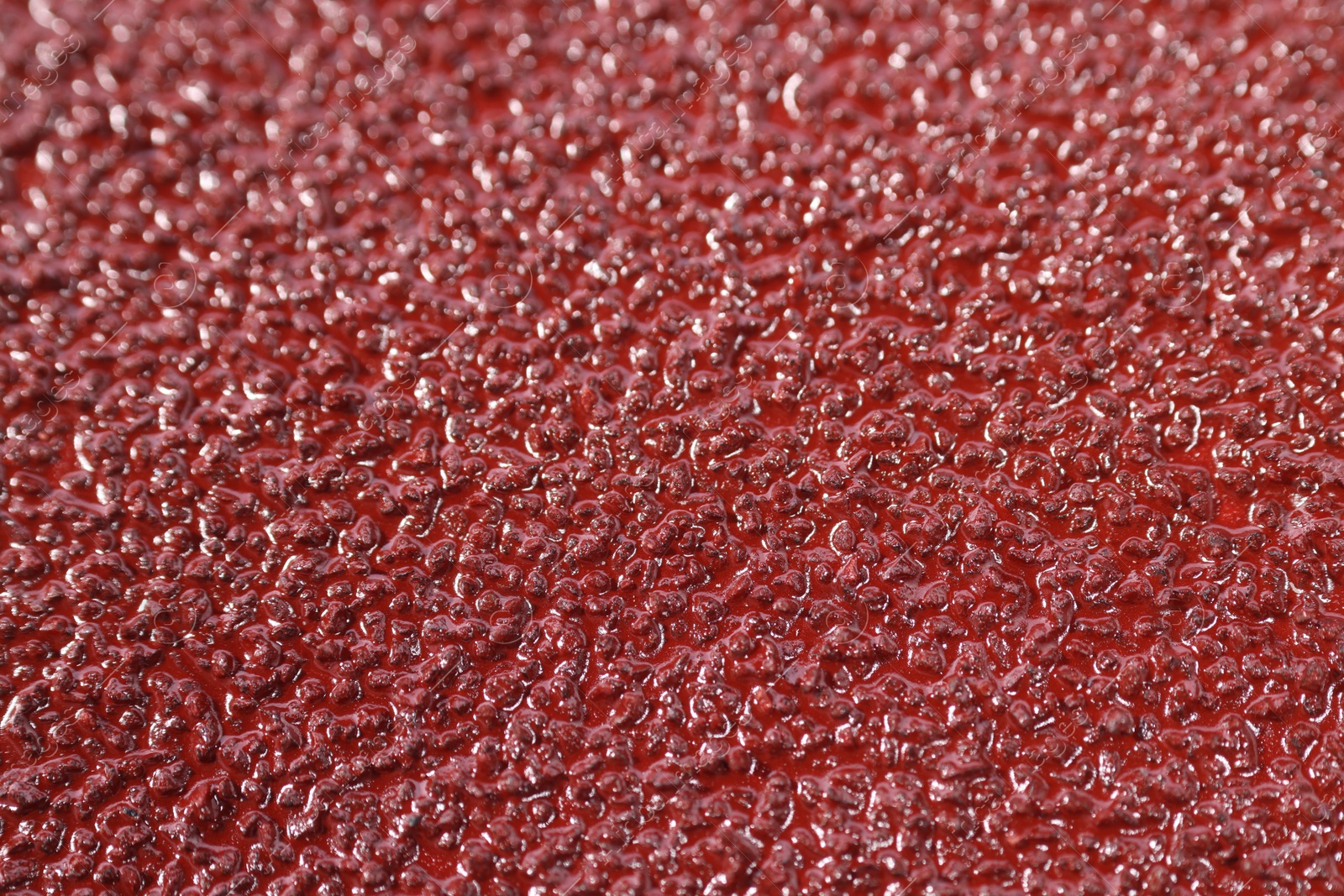 Photo of Texture of coarse sandpaper as background, closeup