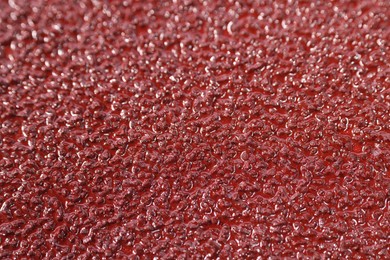 Texture of coarse sandpaper as background, closeup