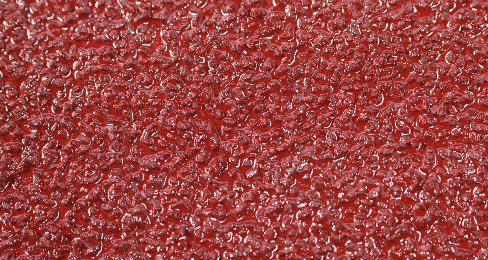 Photo of Texture of coarse sandpaper as background, closeup