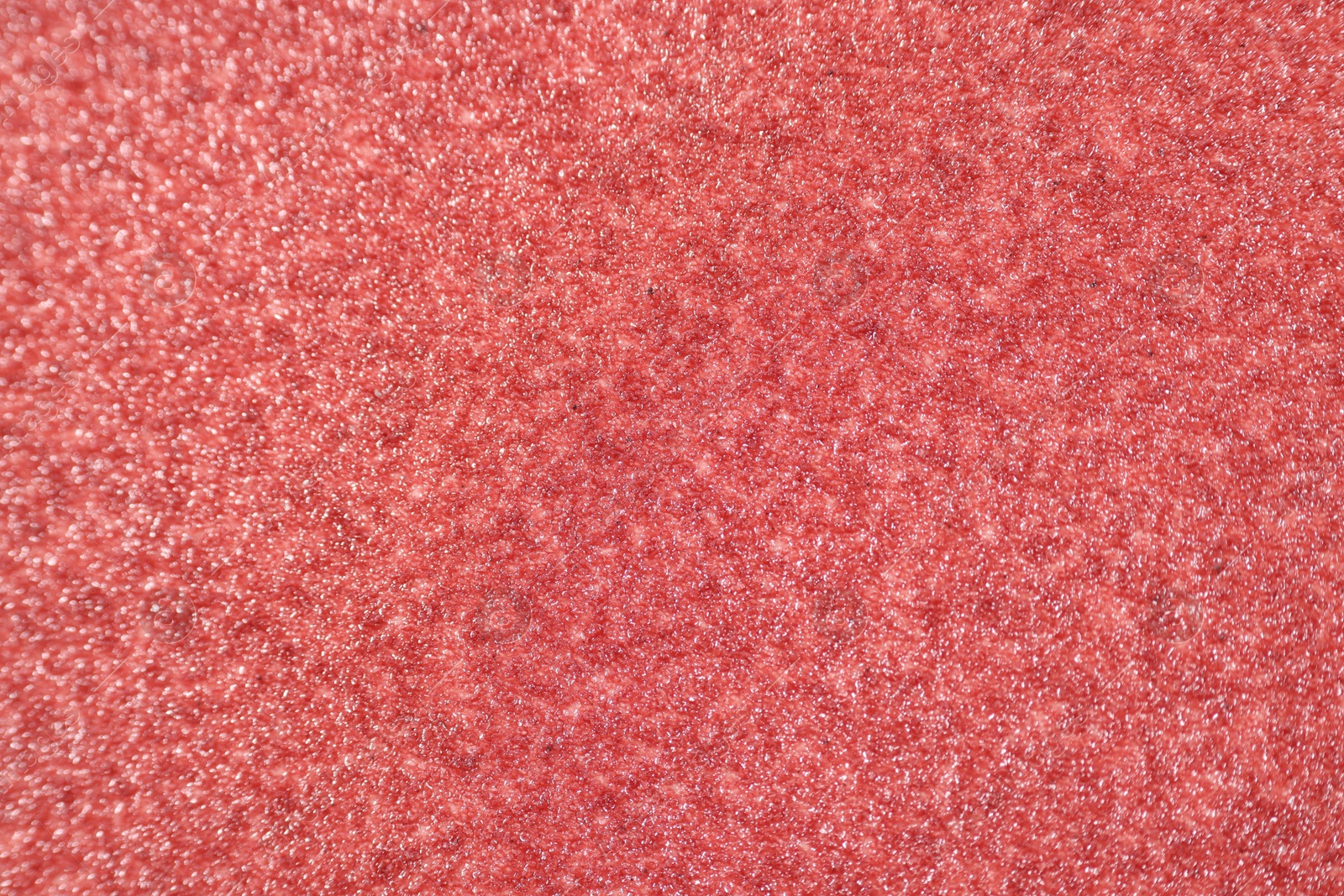 Photo of Texture of coarse sandpaper as background, top view