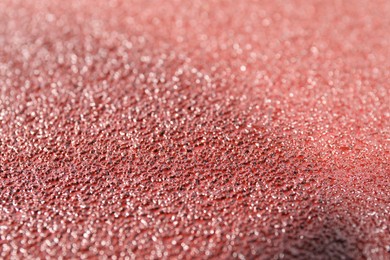 Photo of Texture of coarse sandpaper as background, closeup