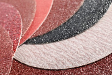 Many sheets of sandpaper as background, closeup