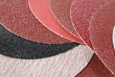 Many sheets of sandpaper as background, closeup