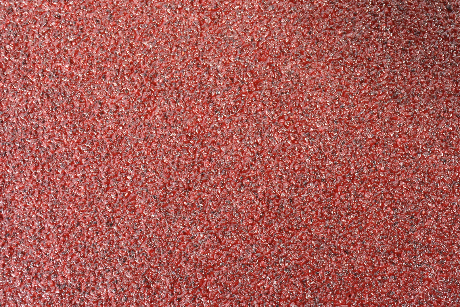 Photo of Texture of coarse sandpaper as background, top view