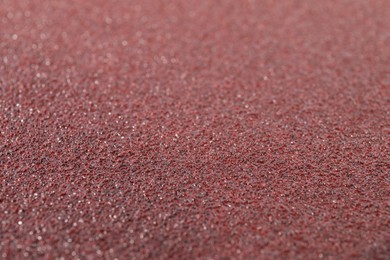 Photo of Texture of coarse sandpaper as background, closeup