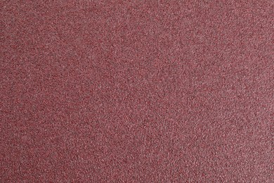 Texture of coarse sandpaper as background, top view