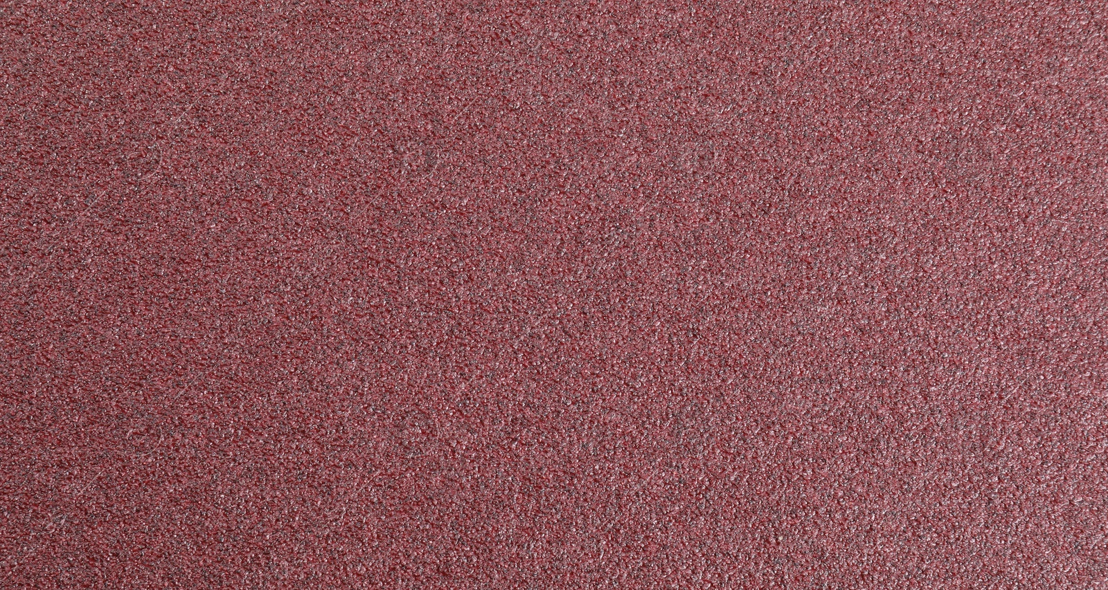 Photo of Texture of coarse sandpaper as background, top view