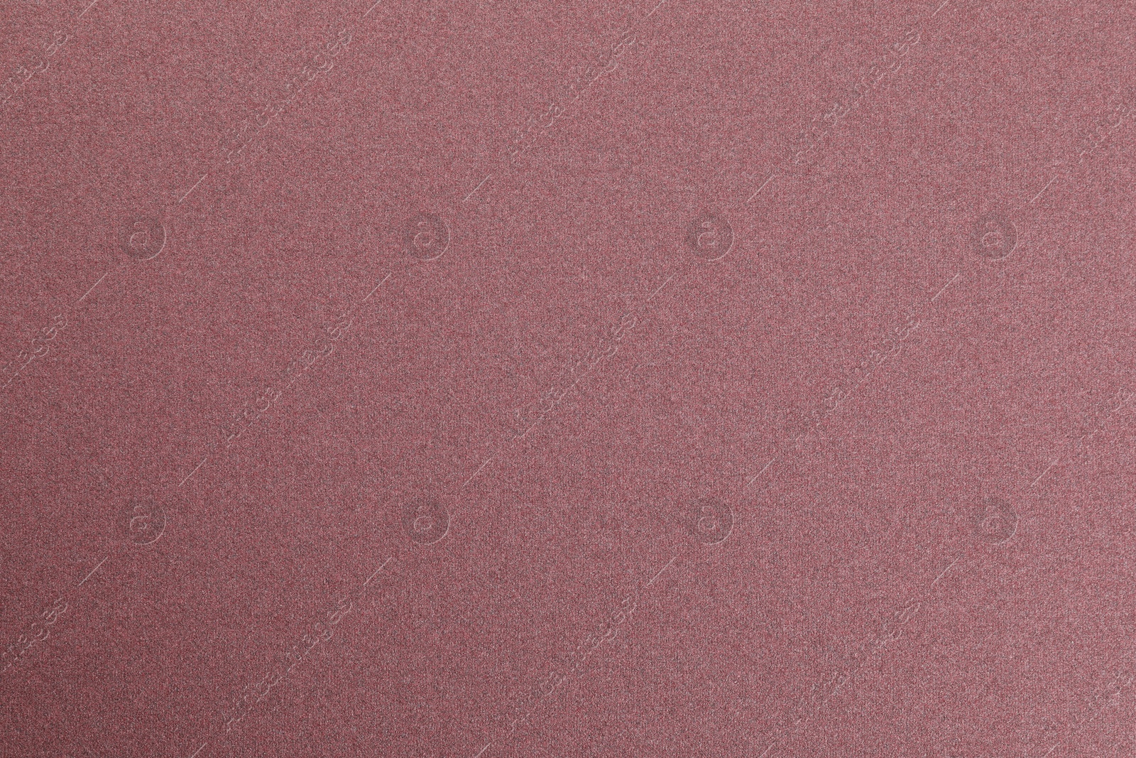 Photo of Texture of coarse sandpaper as background, top view