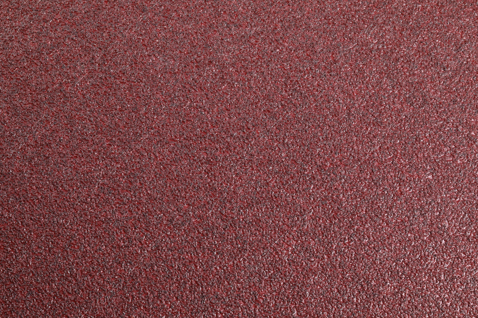 Photo of Texture of coarse sandpaper as background, top view