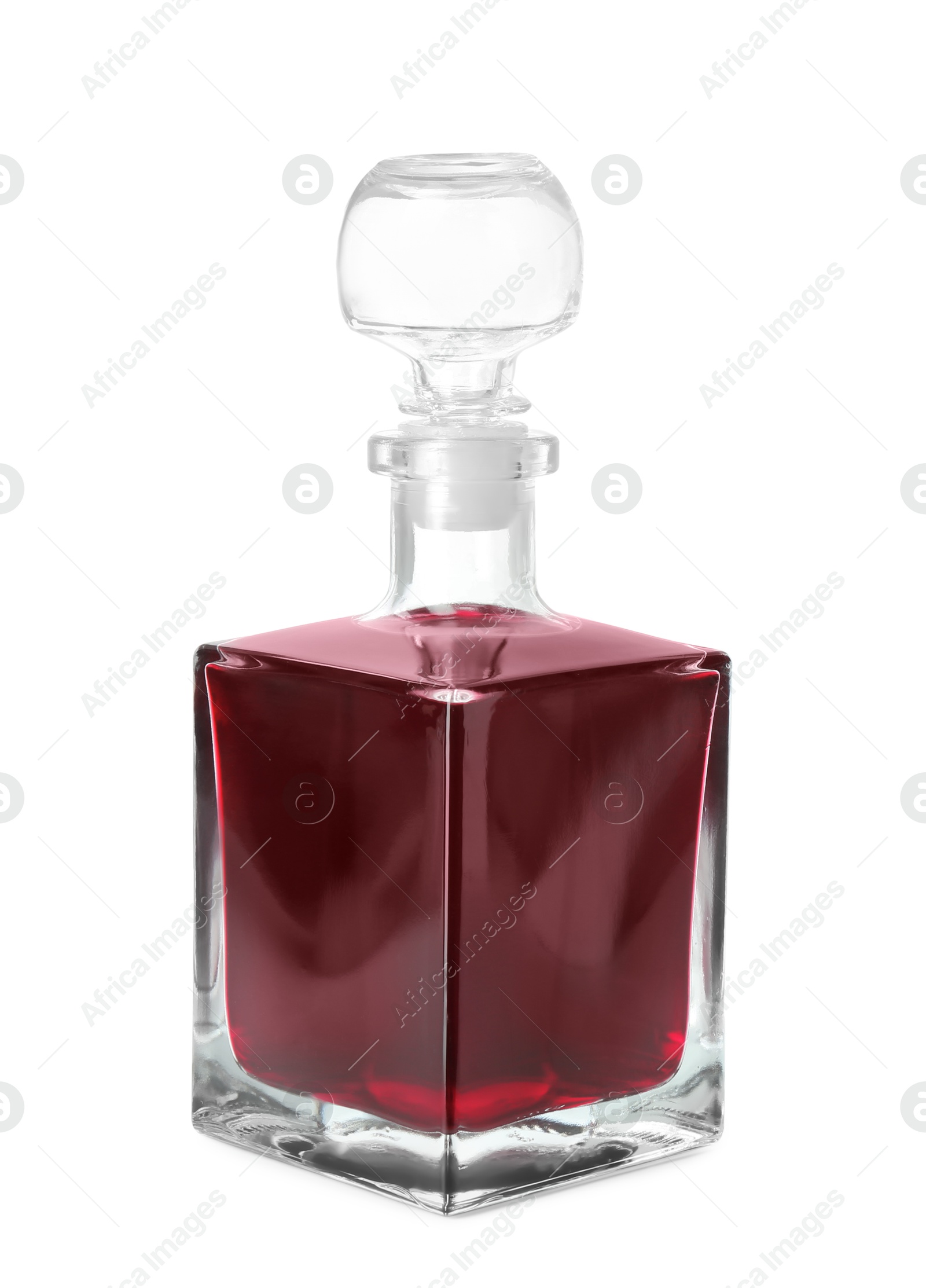 Photo of Bottle of delicious cherry liqueur isolated on white