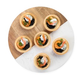 Delicious canapes with shrimps and black caviar isolated on white, top view