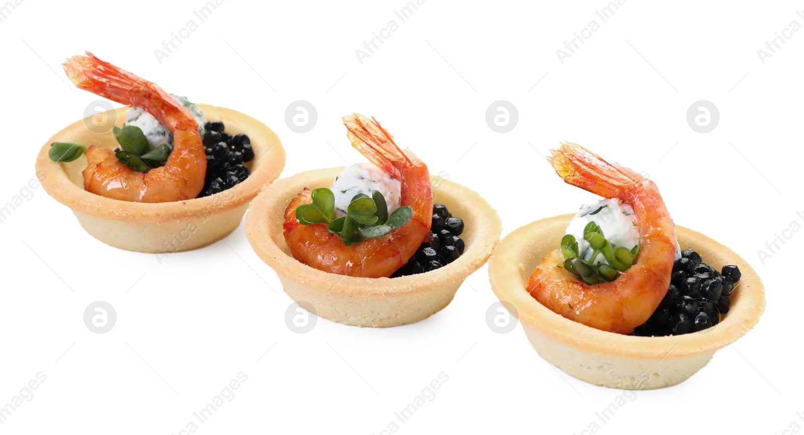 Photo of Delicious canapes with shrimps and black caviar isolated on white