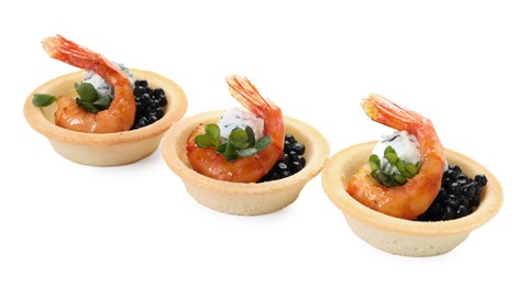 Delicious canapes with shrimps and black caviar isolated on white