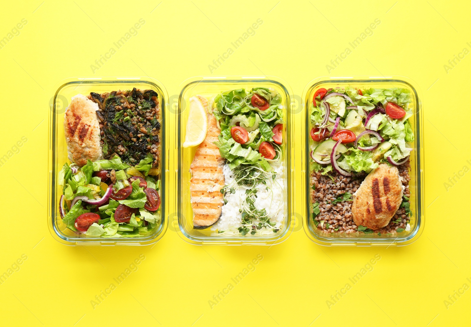 Photo of Healthy food. Different meals in glass containers on yellow background, flat lay