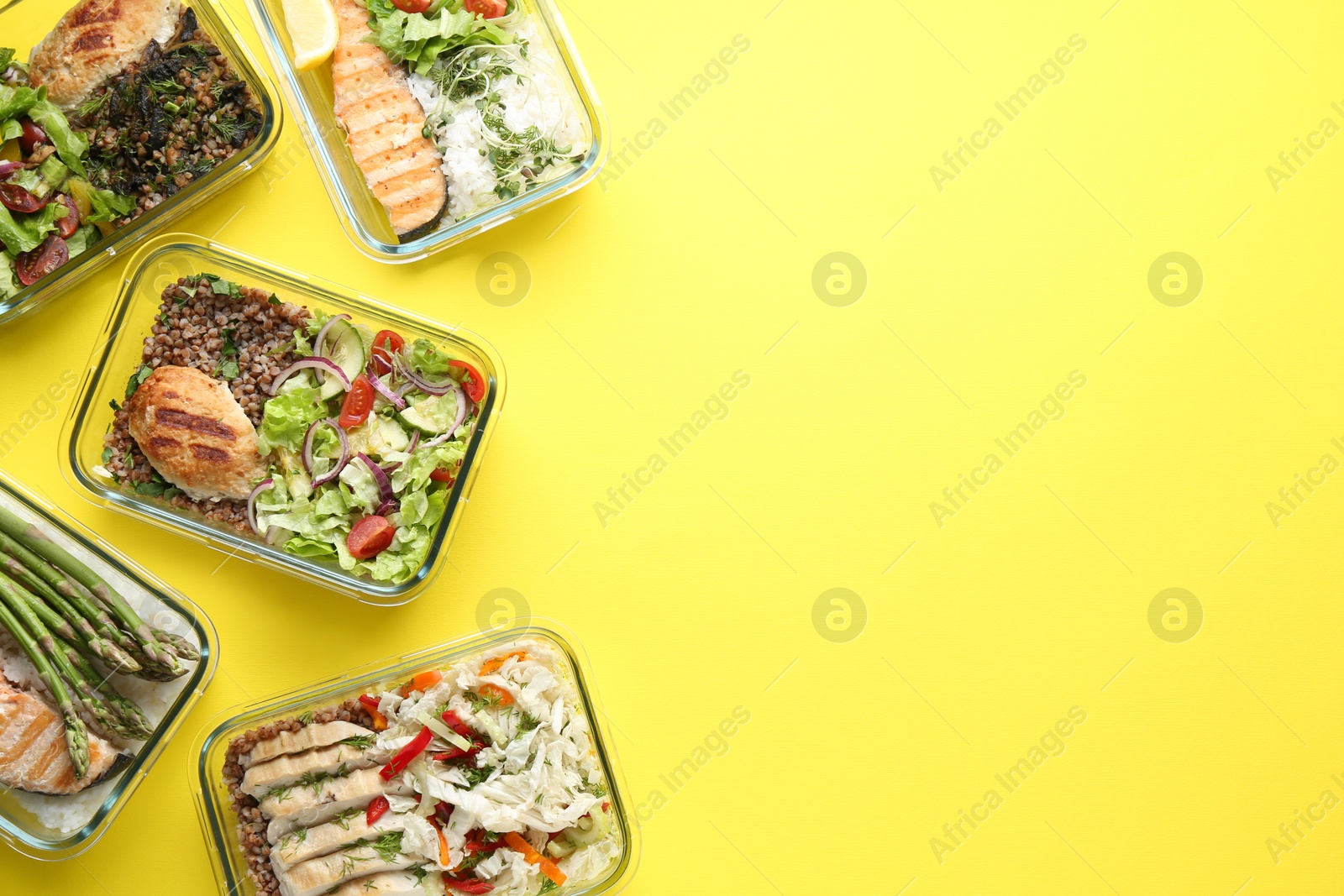 Photo of Healthy food. Different meals in glass containers on yellow background, flat lay. Space for text