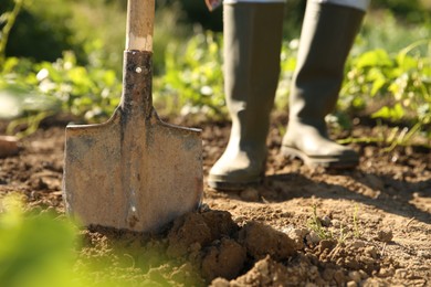 Farmer with shovel on sunny day, closeup